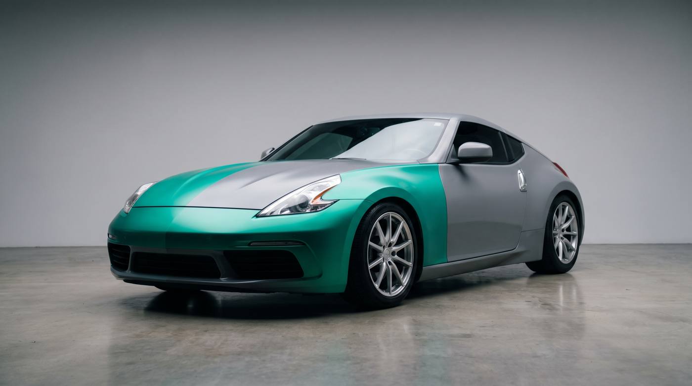 Coupe half wrapped in teal colour film